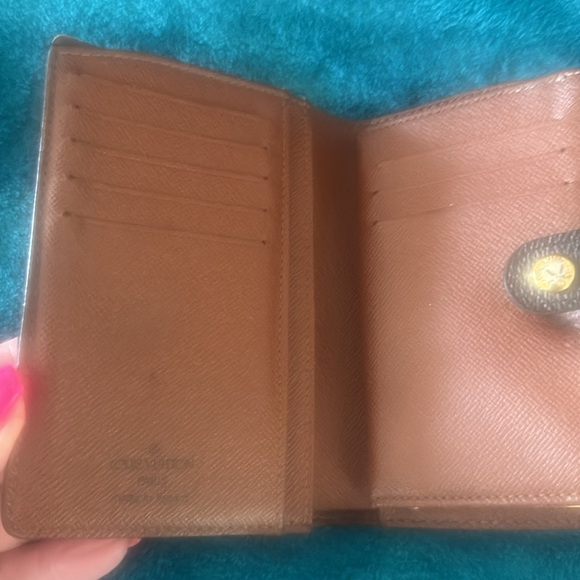 Louis Vuitton and LV wallet included.  There is 2 small marks on the inside - Picture 12 of 16
